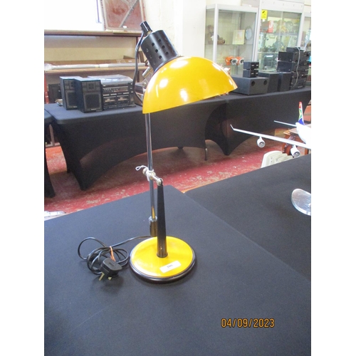 200 - A mid-century desk lamp finished in marigold yellow