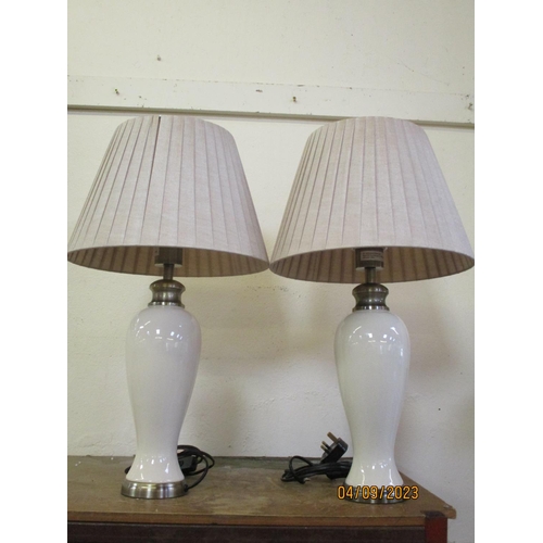 304 - A pair of ivory crackle glazed ceramic table lamps