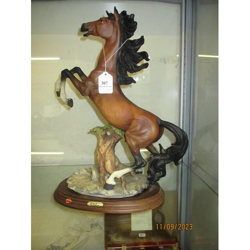 307 - An Italian ceramic model of a rearing horse