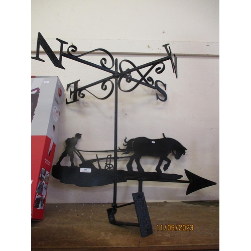 355 - A wrought iron weather vane modelled in the form of a horse plough and farmer