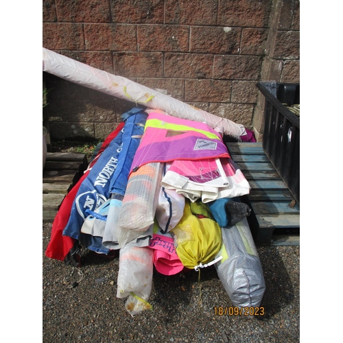 45 - A large and varied assortment of wind surfing sails