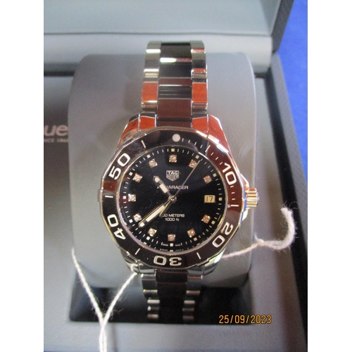 142 - A Tagheuer Aquaracer steel and black ceramic quartz date watch with black diamond set dial