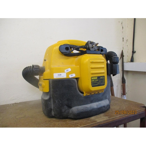 329 - A DeWalt DC500 industrial vacuum cleaner