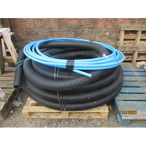 51 - A quantity of land drainage pipe together with a coil of 25mm water pipe