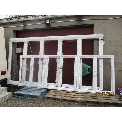 72 - A UPVC bi-fold door system together with three UPVC windows