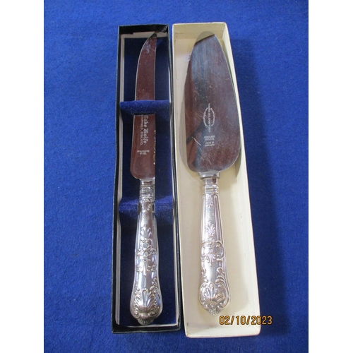 178 - A silver handled cake slice together with a silver handled cake knife