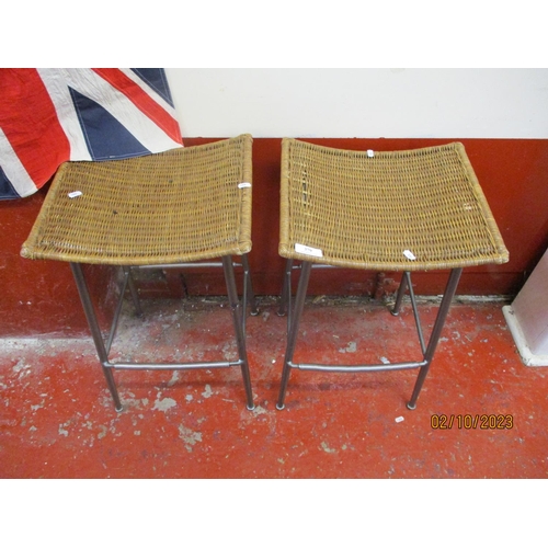 379 - A pair of metallic and rattan breakfast stools