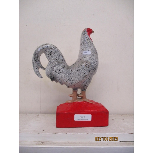 381 - A cast iron door stop modelled in the form of a cock bird