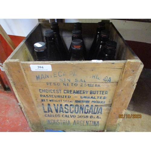 394 - A vintage Argentinian butter box together with nine vintage beer bottles