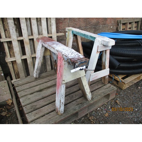 47 - A pair of wooden carpentry trestles, one fitted a vice