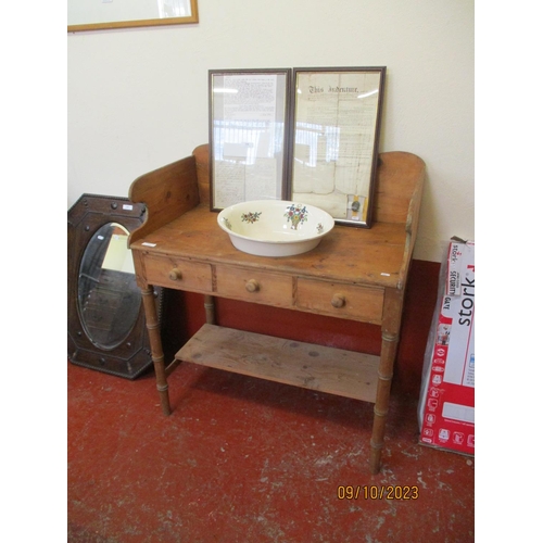 251 - A Victorian pine wash stand fitted three short drawers and a shelf below