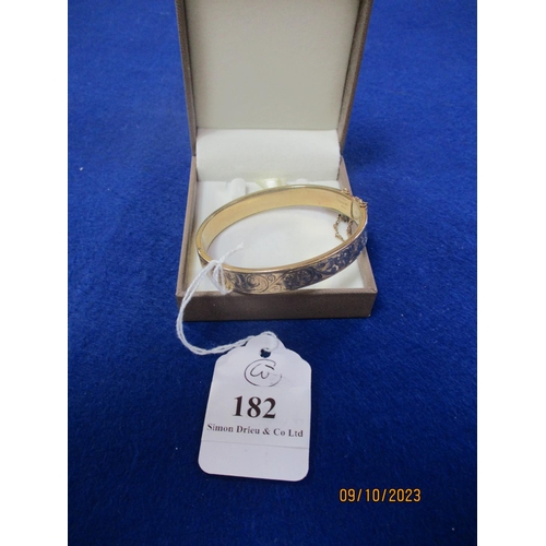 182 - A 9 carat gold plated vintage bangle with foliate decoration