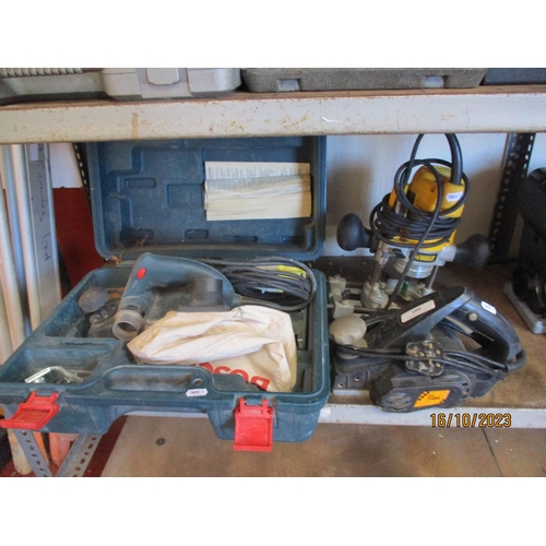 100 - A Bosch 110 volt planer together with one other and a DeWalt router