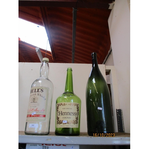 112 - Three vintage bottles of large proportion