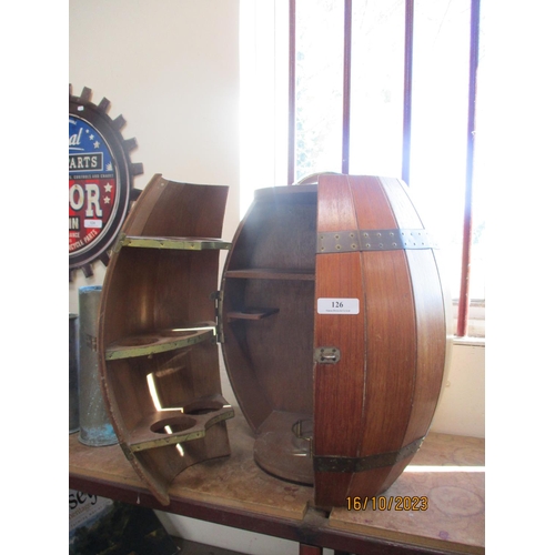 126 - A portable cocktail cabinet modelled in the form of a brass bound cask