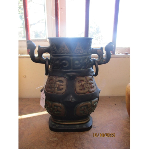 127 - A substantial oriental bronze twin handled vase