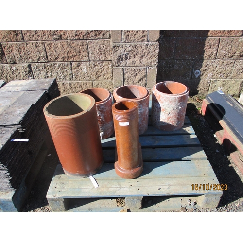 35 - Two glazed terracotta drain pipes together with three terracotta chimney liners