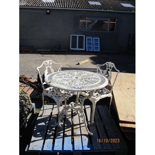 69 - A pierced aluminium circular garden table together with two matching chairs