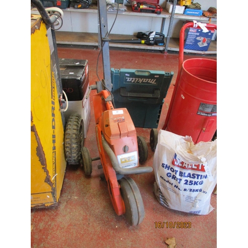 87 - A Husqvarna 272S stump grinder complete with trolley