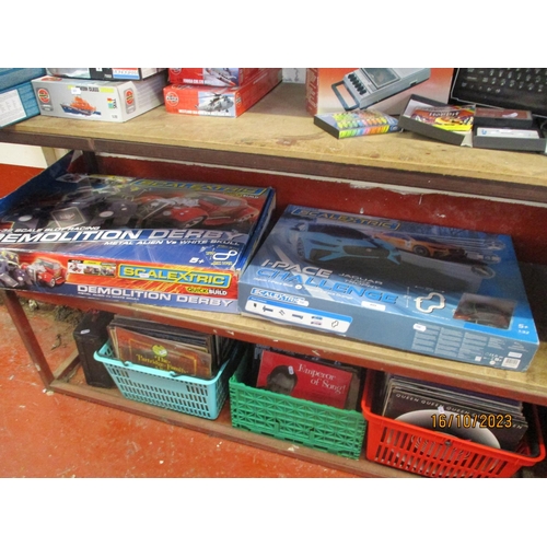 409 - A Scalextric Demolition Derby racing game together with a Scalextric I-Pace Channel racing game