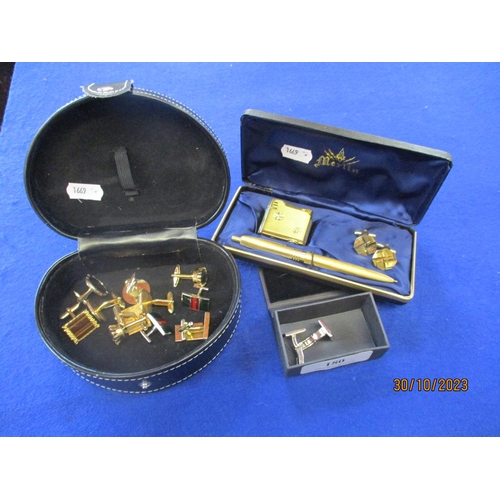 180 - A collection of cufflinks together with a Merlin cufflink, cigarette lighter and pen set