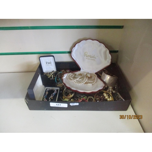 184 - An accumulation of costume jewellery, wrist watches and miscellanea