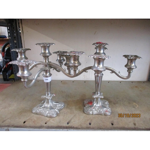 106 - A pair of five branch candelabra