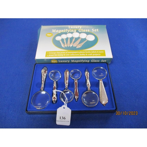 136 - A six piece luxury magnifying glass set