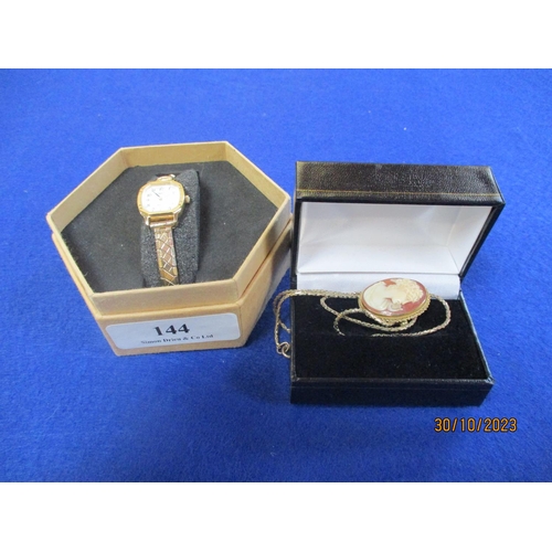 144 - A lady's Tissot cocktail watch with expanding strap together with a cameo on chain