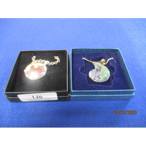 146 - A silver pendant on chain together with an abalone and silver pendant on chain