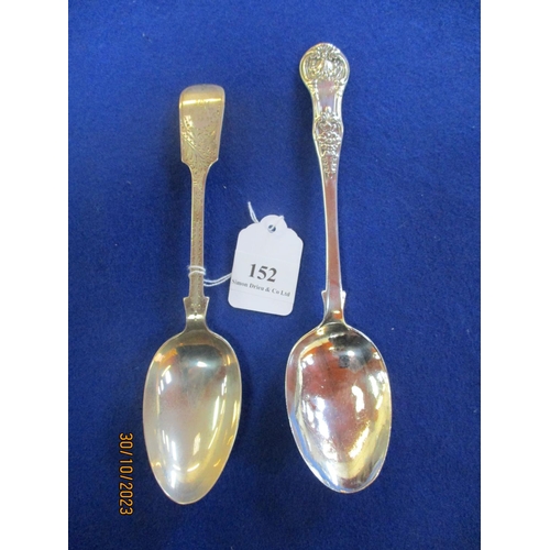 152 - A silver bright cut serving spoon together with a silver serving spoon with scallop and foliate deco... 