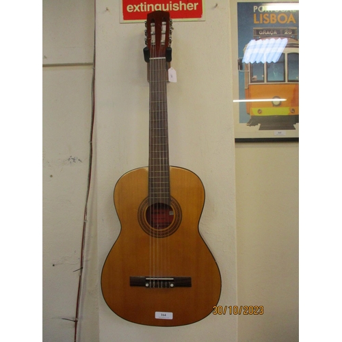 164 - A Minnaco acoustic guitar