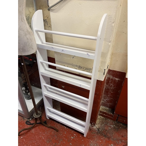 427 - A white finished four tier shelf unit