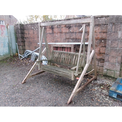 30 - A teak swinging garden seat