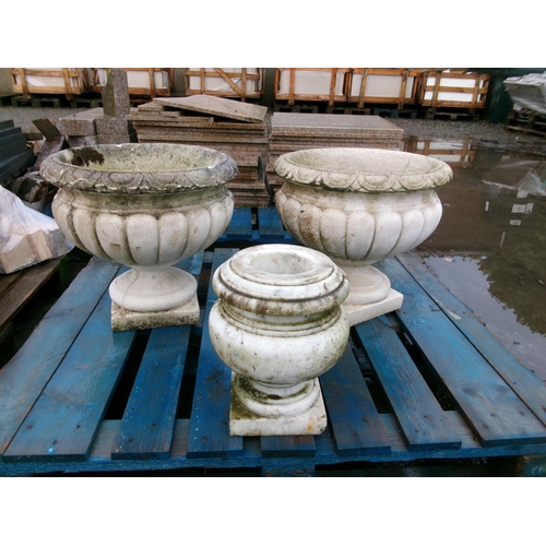 58 - A pair of reconstituted stone stemmed circular garden urns together with a white marble urn