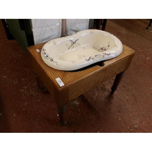 228 - A nineteenth century pine and ceramic bidet