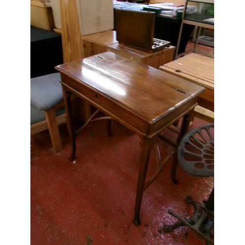 237 - A hard wood writing desk with mechanical opening mechanism to reveal a brown gilded and tooled leath... 