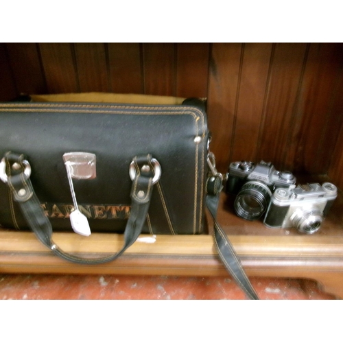 315 - A Minolta XG-M camera together with a Franka camera, accessories and bag