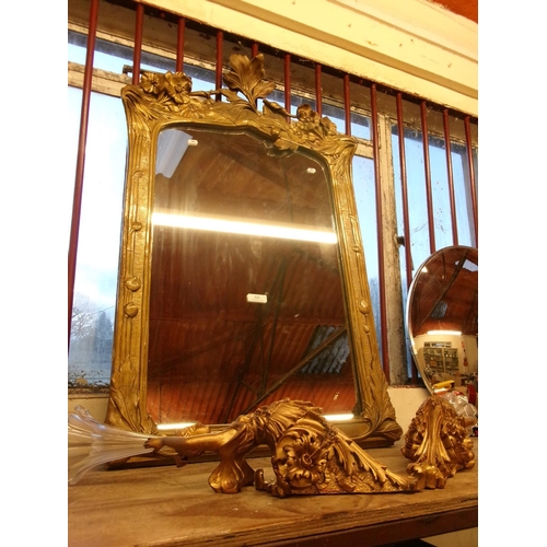 323 - A gilt framed rectangular wall mirror together with a pair of gilded figural wall sconces