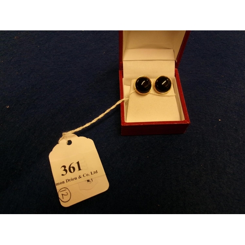 361 - A pair of onyx cabochon 9 carat gold earrings