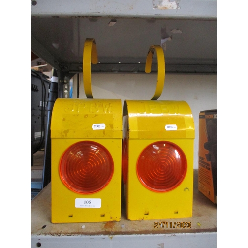 105 - Two vintage road work lamps