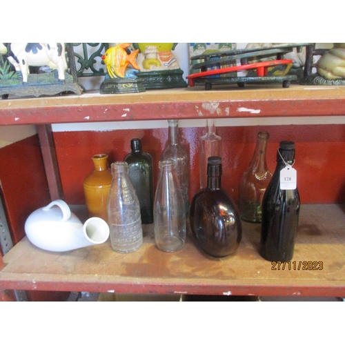 128 - A collection of vintage bottles etc.