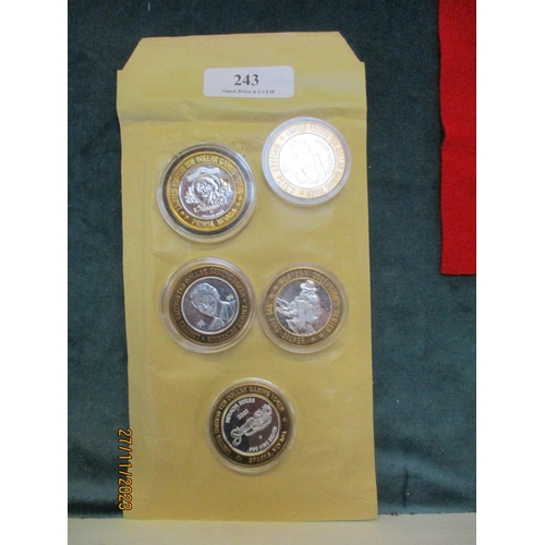 243 - Five solid silver casino coins