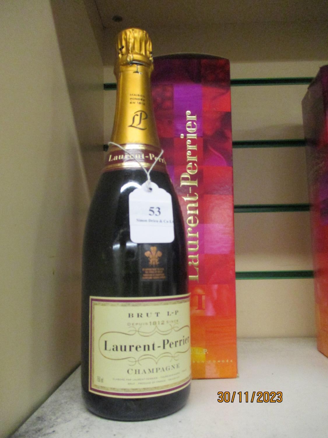 A bottle of Laurent Perrier Brut L-P Champagne