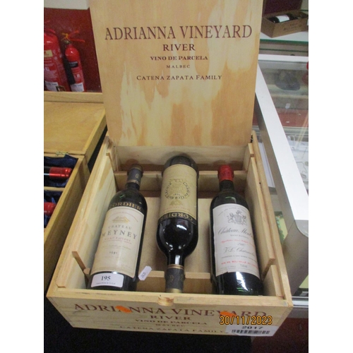 195 - A luxury box of wine to include a bottle of 1981 Chateau Meyney, a bottle of 1980 Montrose and a bot... 