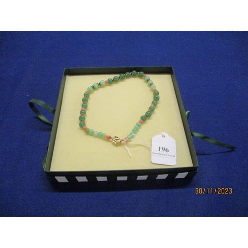 196 - A jade and coral necklace with 9 carat gold and pearl clasp