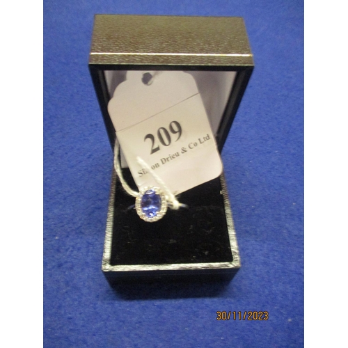 209 - A large AAA certificated tanzanite and diamond halo ring size T