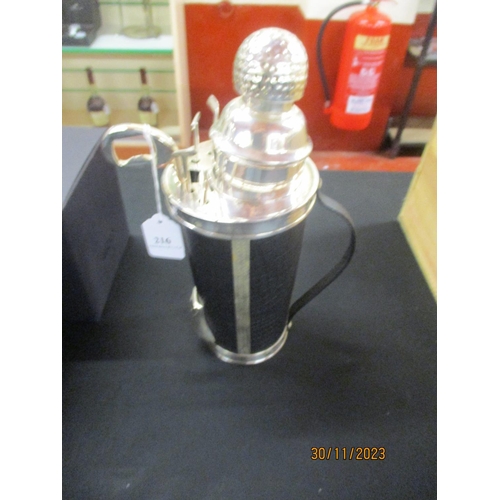 216 - A silver plated novelty cocktail shaker modelled in the form of a golf bag, clubs and accessories