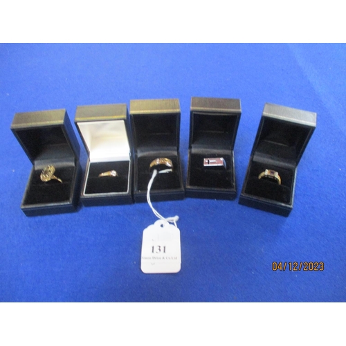 Five assorted 9 carat gold rings