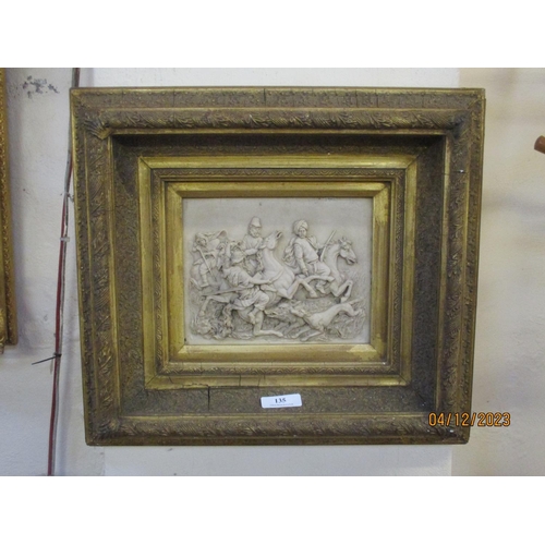 135 - A wall plaque depicting a boar hunting scene in heavy gilt frame and modelled in the vintage style